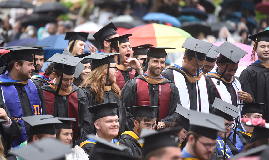 A view of the graduates wearing caps and gowns at commencement 