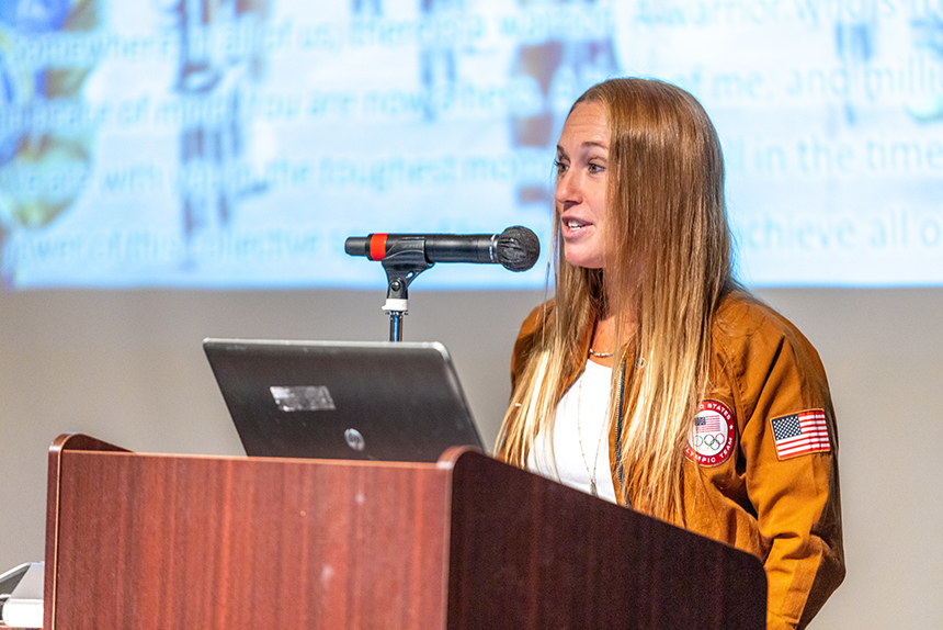 woman speaks at podium