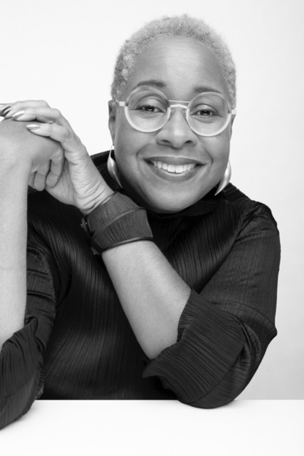 woman smiling in black-and-white headshot