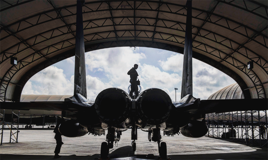 Man standing on fighter jet