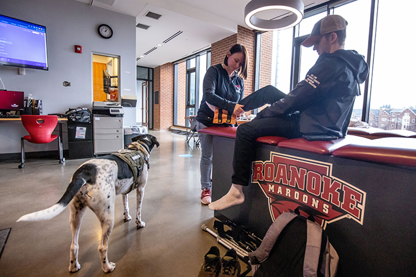 Milo hangs out while Oney works with wrestler Michael Policarpo '26.