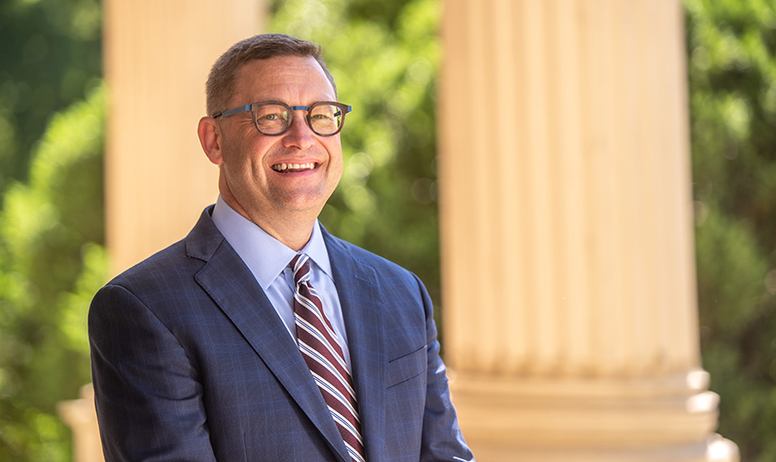 President Frank Shushok Jr. on porch of Administration Building