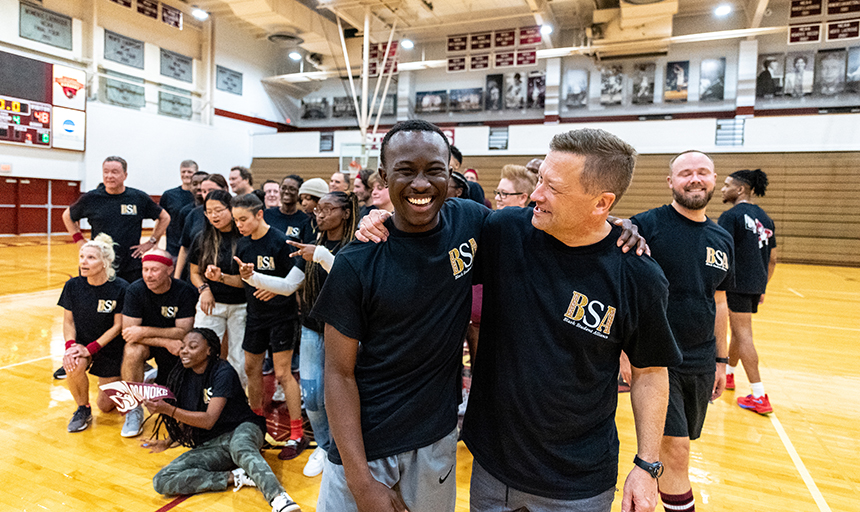 Shushok grabs a photo with Archie Jacinto '25 after the Black Student Alliance Faculty/Staff vs. Students Basketball Tournament on Family Weekend.