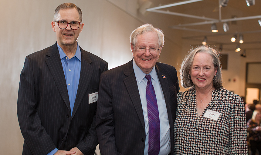 Forbes grabs a photo with David Guy '75, who sponsors the lecture series, and Guy's wife, Patty.