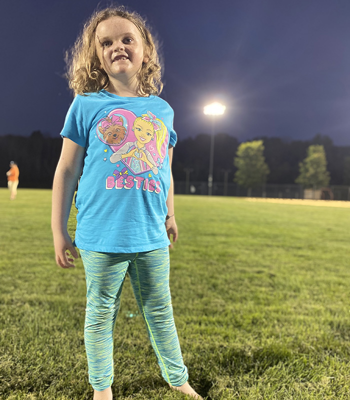 girl standing outside at night