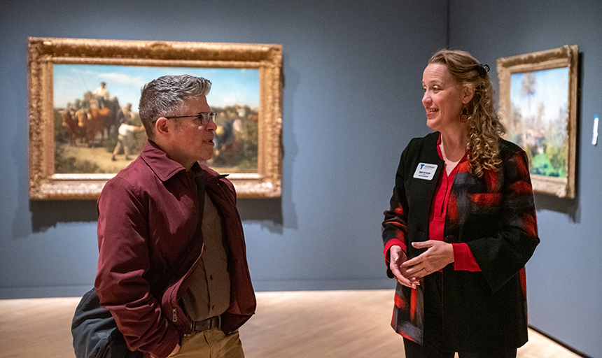 Marsh talks with Cindy Petersen, executive director of the Taubman Museum, in one of the "Titian to Monet" galleries.