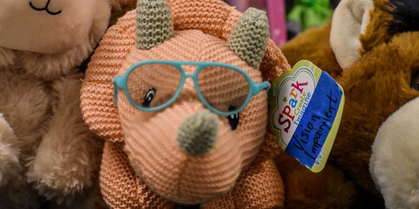 A stuffed dinosaur was modified to include a pair of glasses.