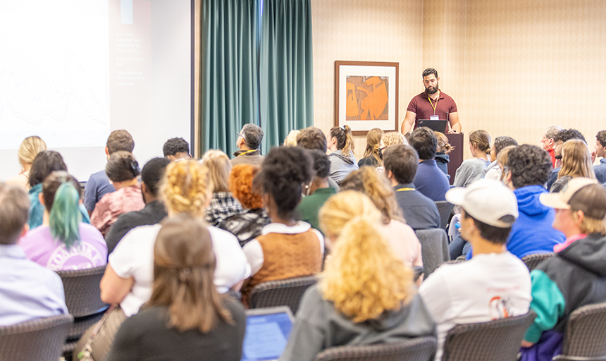 Youssef Labriny '22 presents to a packed Pickle Lounge at the Colket Center during the Virginia Conference on Race in 2022.