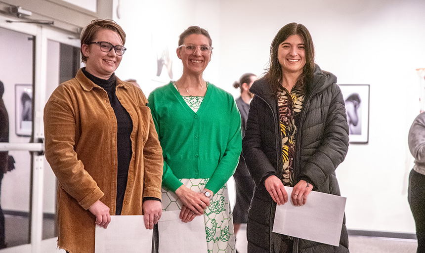 The winners of the 2023 Biennial Juried Exhibition stand next to one another for a photo