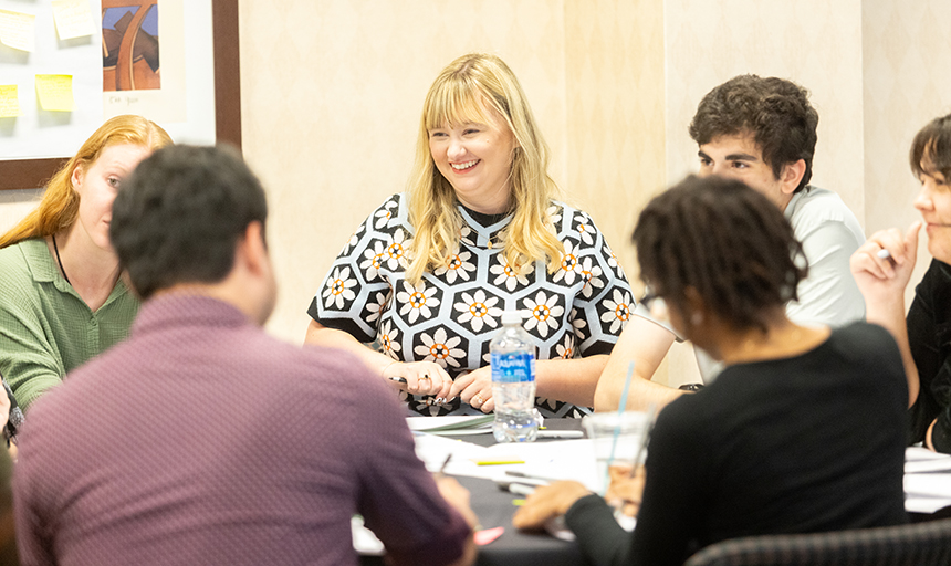 Six students sit around a table discussing the Future of Work at a two-day seminar that took place in 2023.