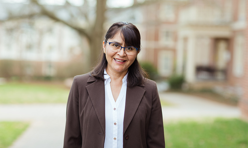 Professor Flores-Silva smiles for a portrait photo 