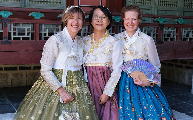 Three Roanoke professors wearing Korean hanboks