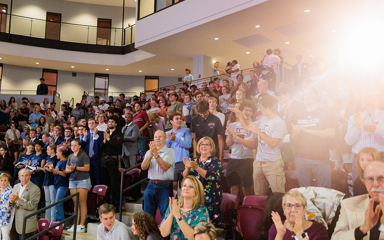 Audience members give Kristin Armstrong a standing ovation at the conclusion of her remarks