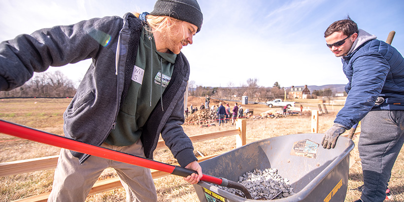 Student shovels gravel