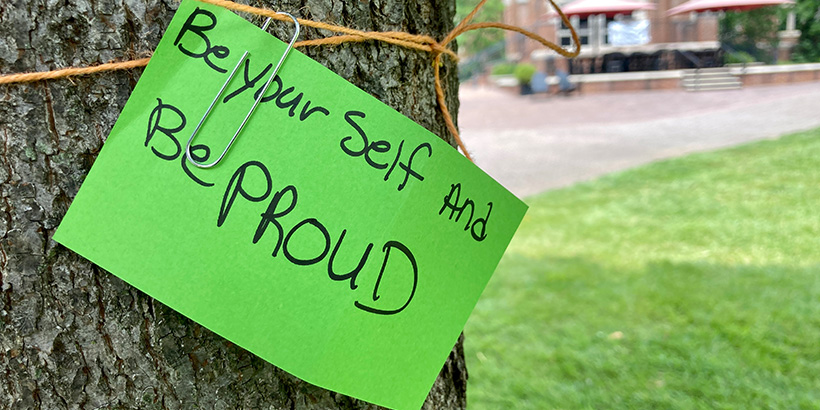 A handwritten card bears the message Be Yourself And Be Proud