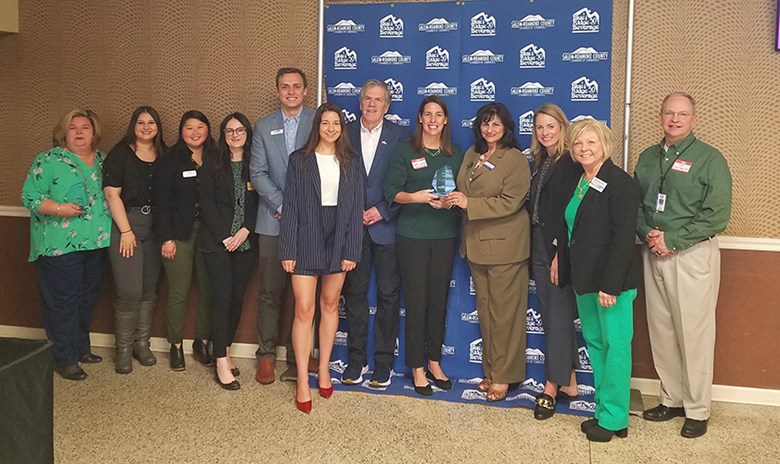 A group of Roanoke College alumni pose for picture celebrate the school’s Large Business of the Year Award at the 2023 Business Awards Breakfast