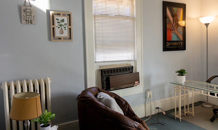 Photo of the Relaxation Room including a comfortable armchair, artwork and a potted plant