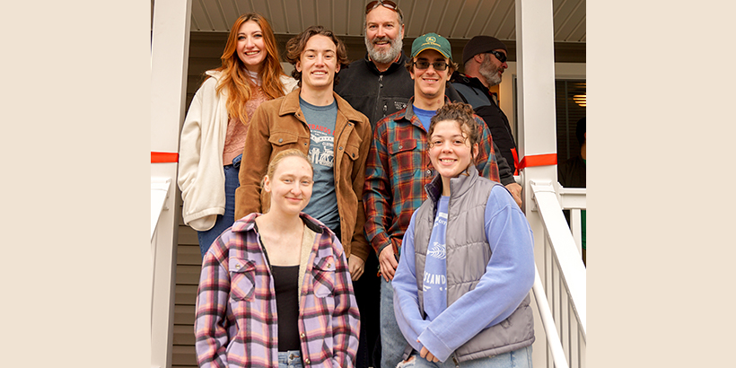 Roanoke College students on porch of new Habitat home