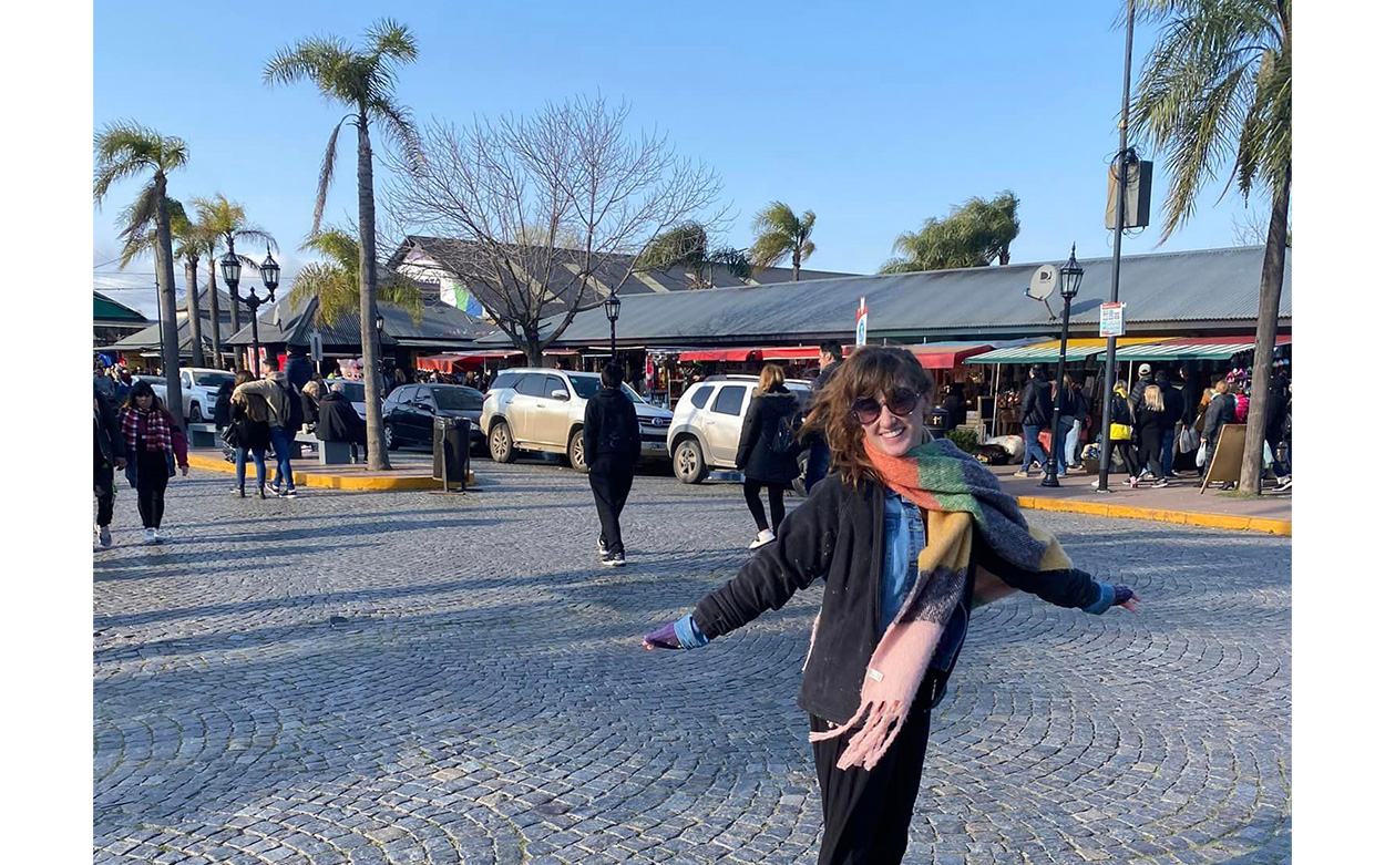 Autumn Goff smiling with a bustling street in the background