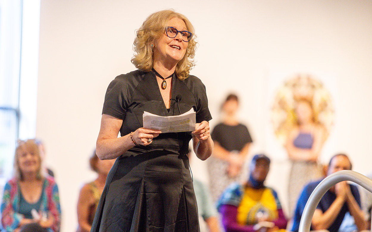 Artist Simone Paterson addresses the gathering at the opening reception for her new exhibit