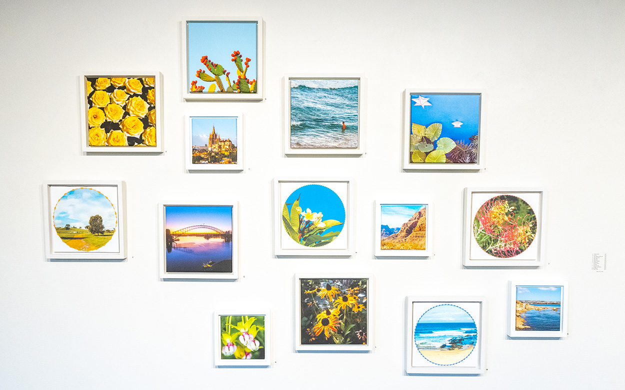A gallery wall of vivid yellow and blue dominant photos from artist Simone Paterson's travels