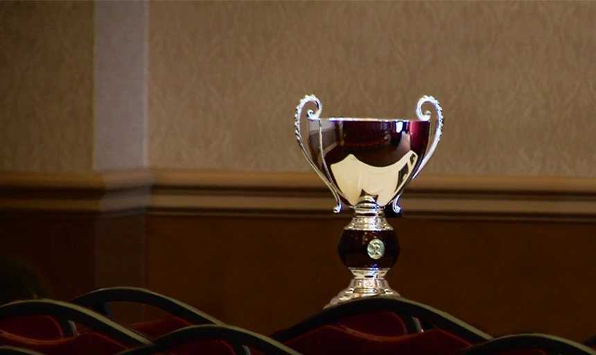 A picture of the gold-colored Ethics Bowl trophy