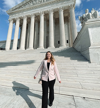 Jocelyn Snader walks down the steps of the U.S. Supreme Court building