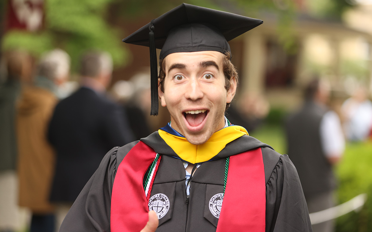 A student smiles widely for the camera