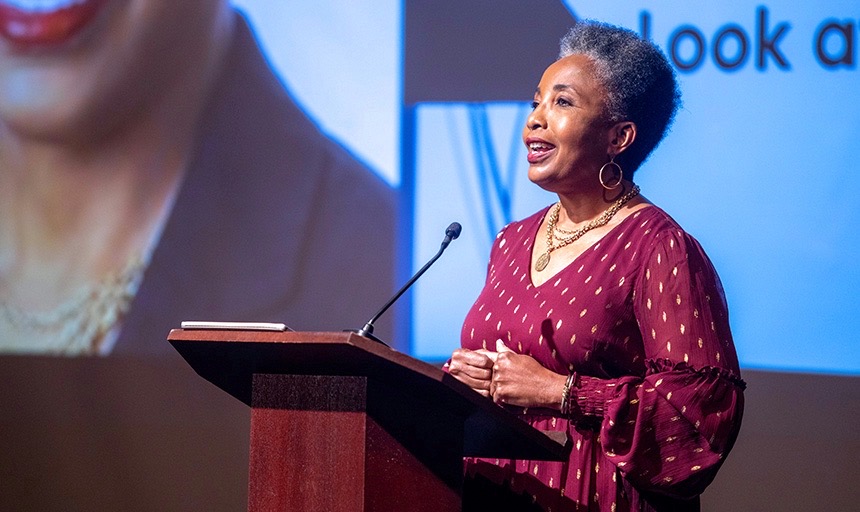 Carol Swain speaking at a dais in Roanoke College's Wortmann Ballroom