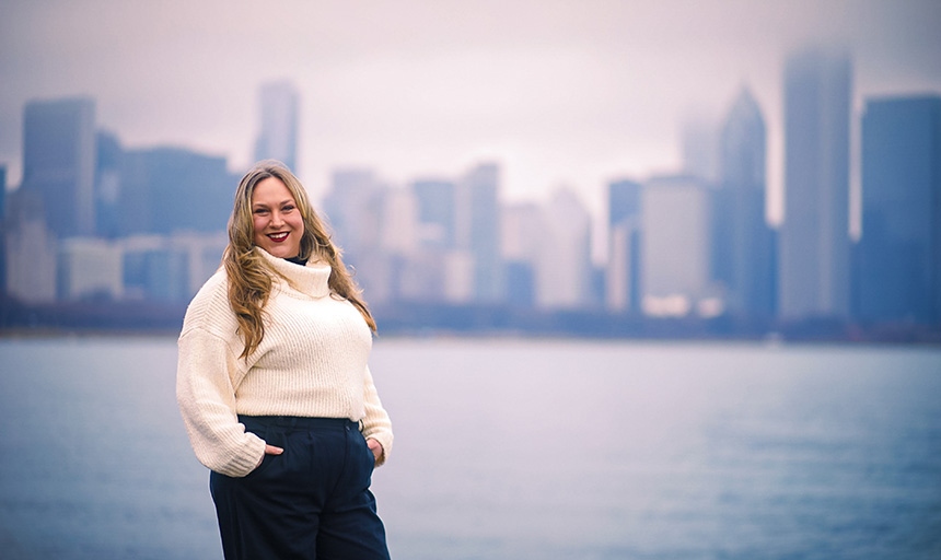 Dessa Gypalo smiling along the riverfront of Chicago