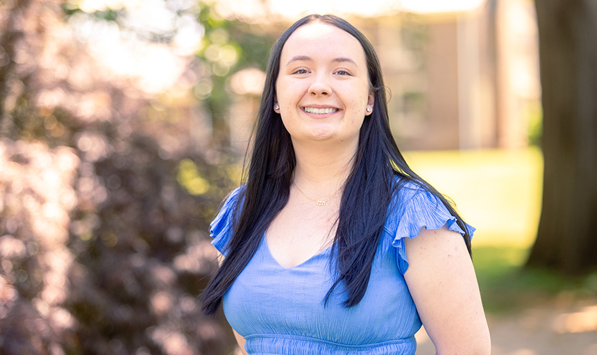 A student smiles for a portrait photo