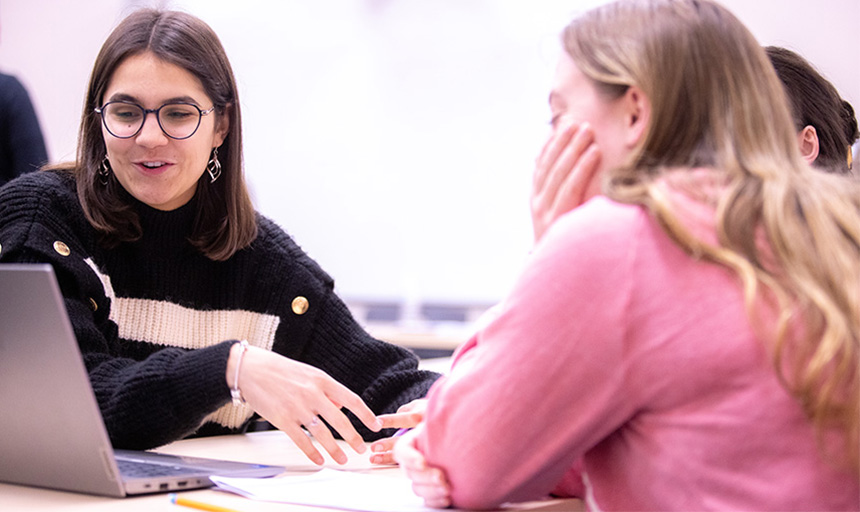 Students working together at a table in a classroom