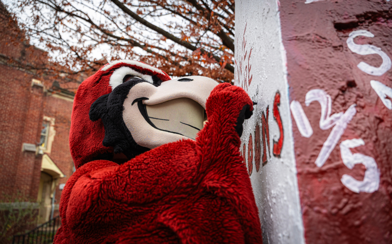 Rooney signs The Rock on Community Day.