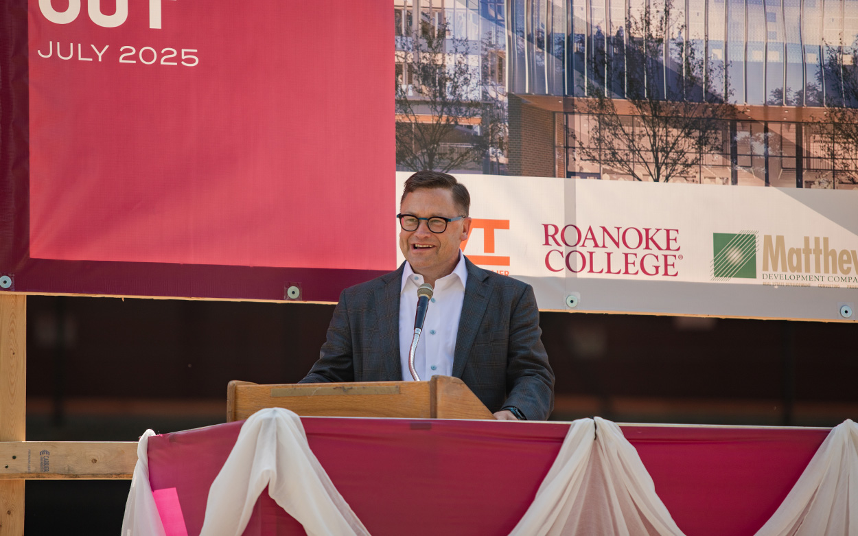 A man speaks at a podium