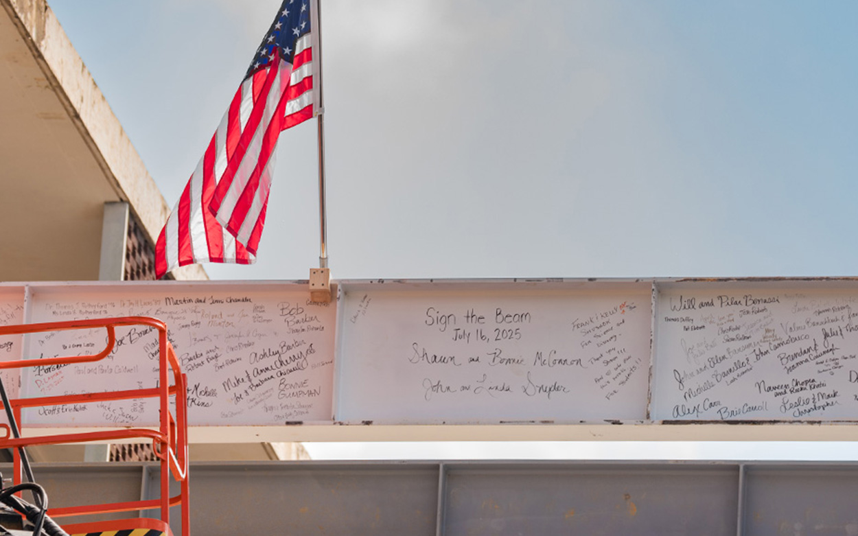 A beam with handwritten names inscribed on it