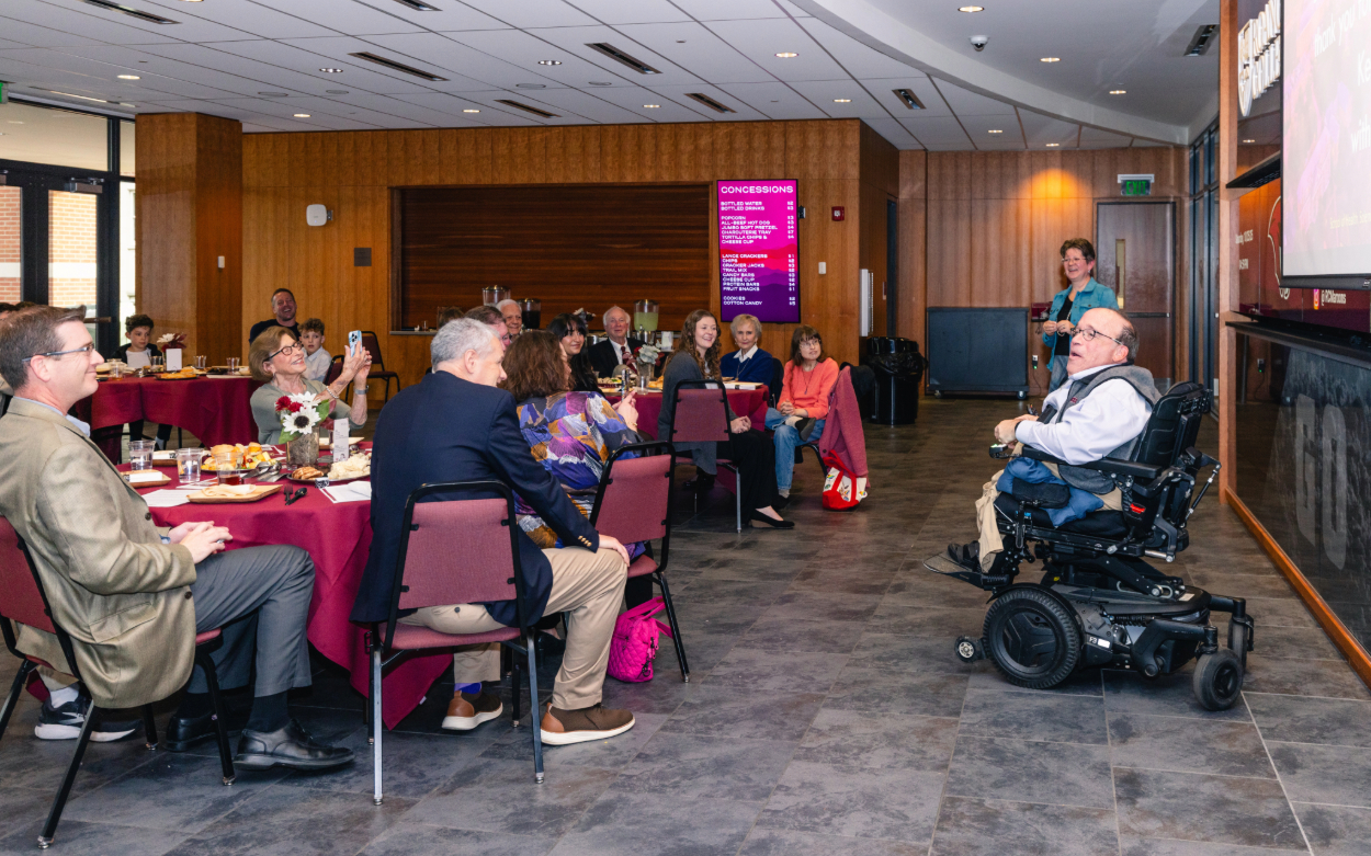 Kent Shiner speaks during the surprise celebration in his honor on Oct. 25 in the foyer of the Cregger Center