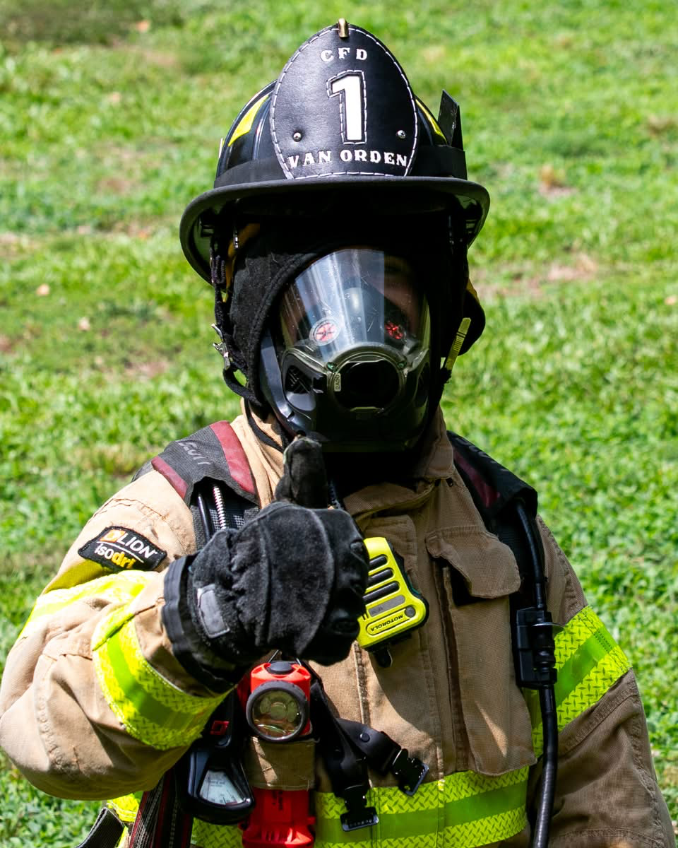 Connor Van Orden '24 in a firefighter uniform.