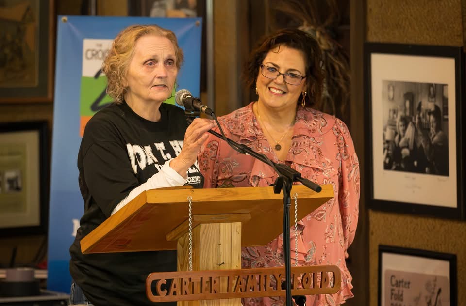 Rita Forrester (L), outgoing executive director of the Carter Family Fold, and Ellen Stroud (R), the Fold's new executive director, are pictured at the Carter Family Fold during the 52nd Annual Carter Family Memorial Music Festival on Aug. 1, 2026. 