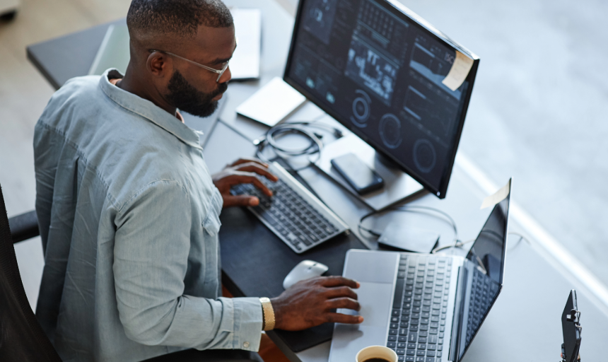 A man working at a computer in an office
