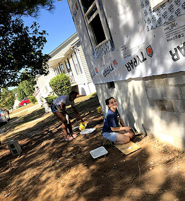 students working on a house