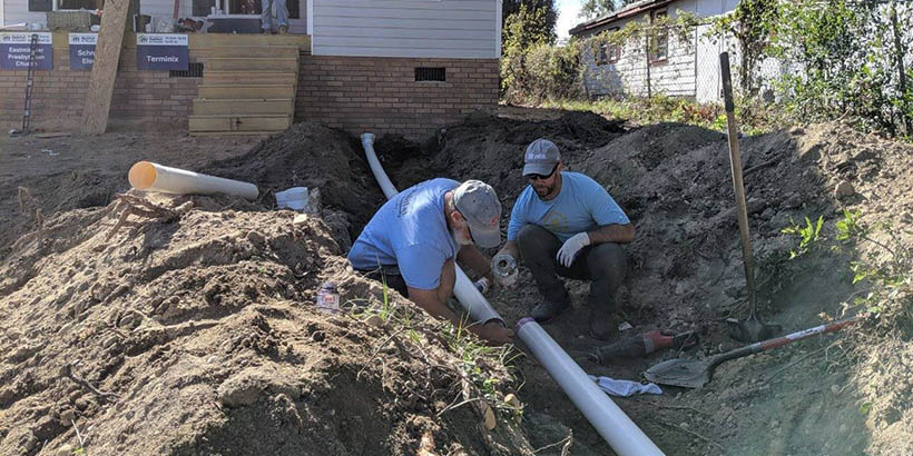 Chaplain Chris digging in the ground