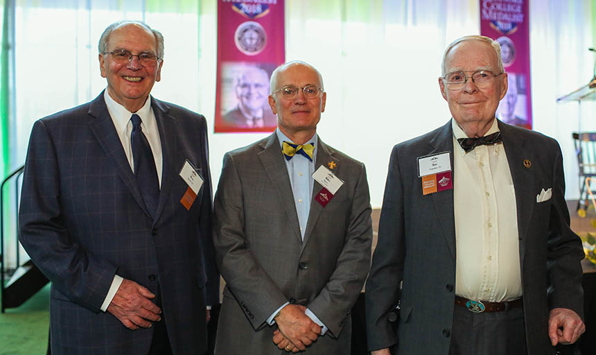 Wes Graves, President Maxey and Rae Carpenter posing for a photo