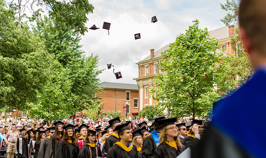 Commencement hats in the air