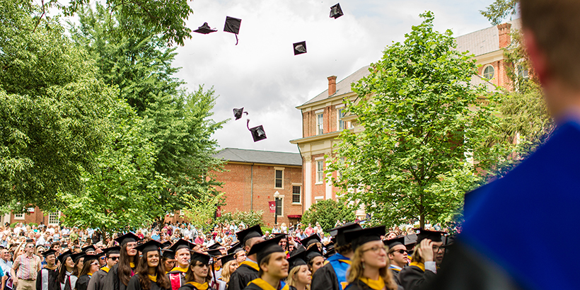 Graduates throwing their caps in the air