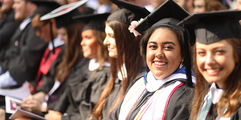 Graduates smiling for a photo