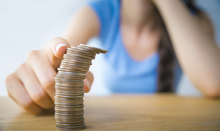 Stack of coins about to fall over