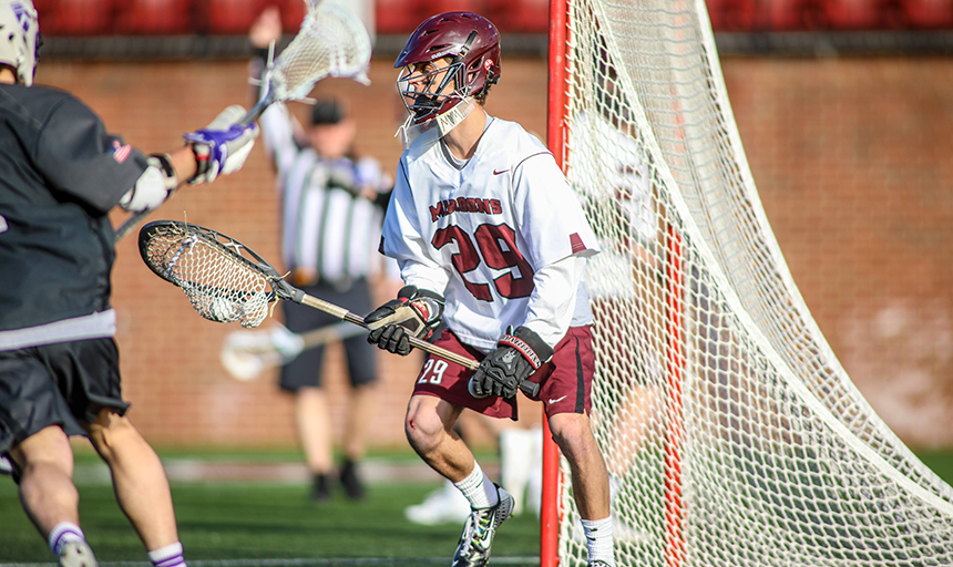 Ian Davies in goal during lacrosse game