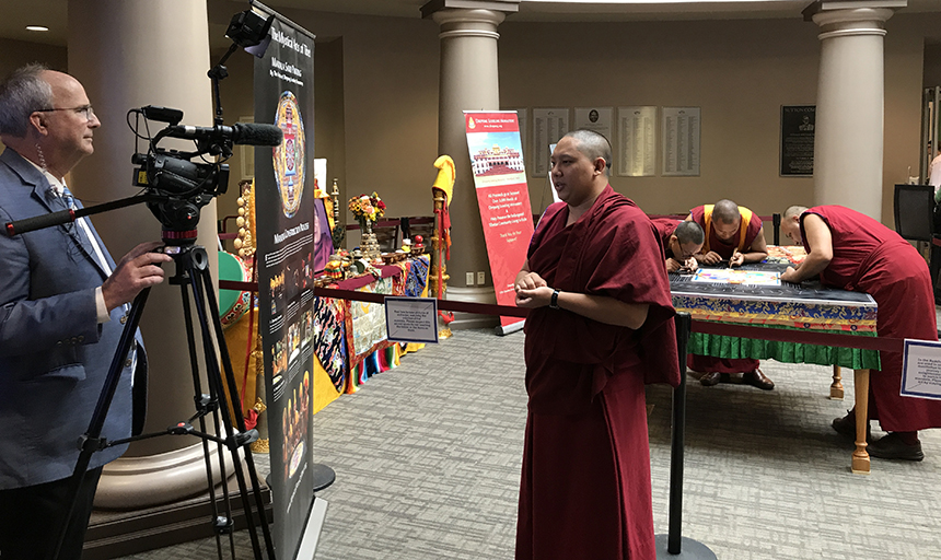 WDBJ reporter interviews one of the Tibetian monks