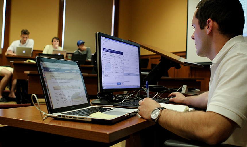 students at computers in Investment class