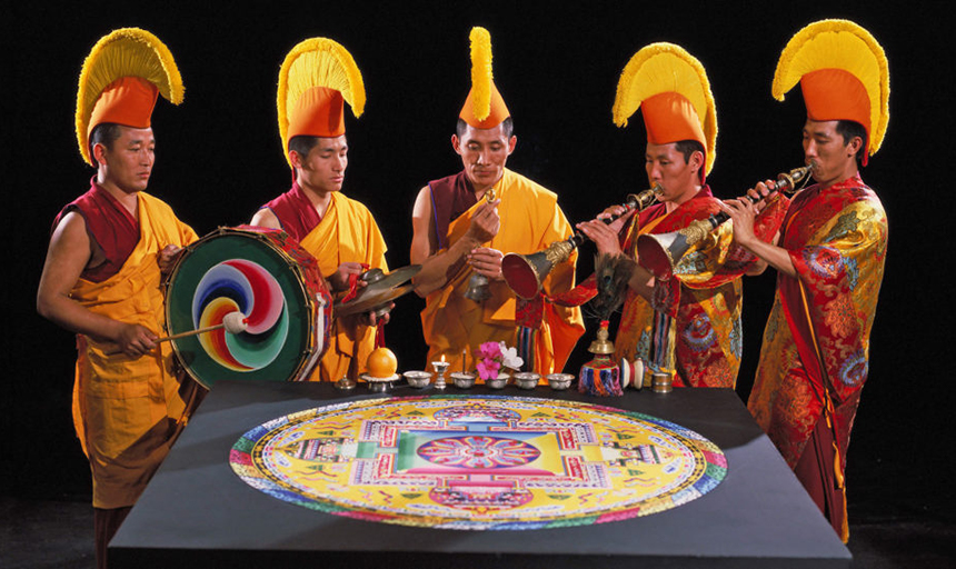 Tibetan monks with sand mandala